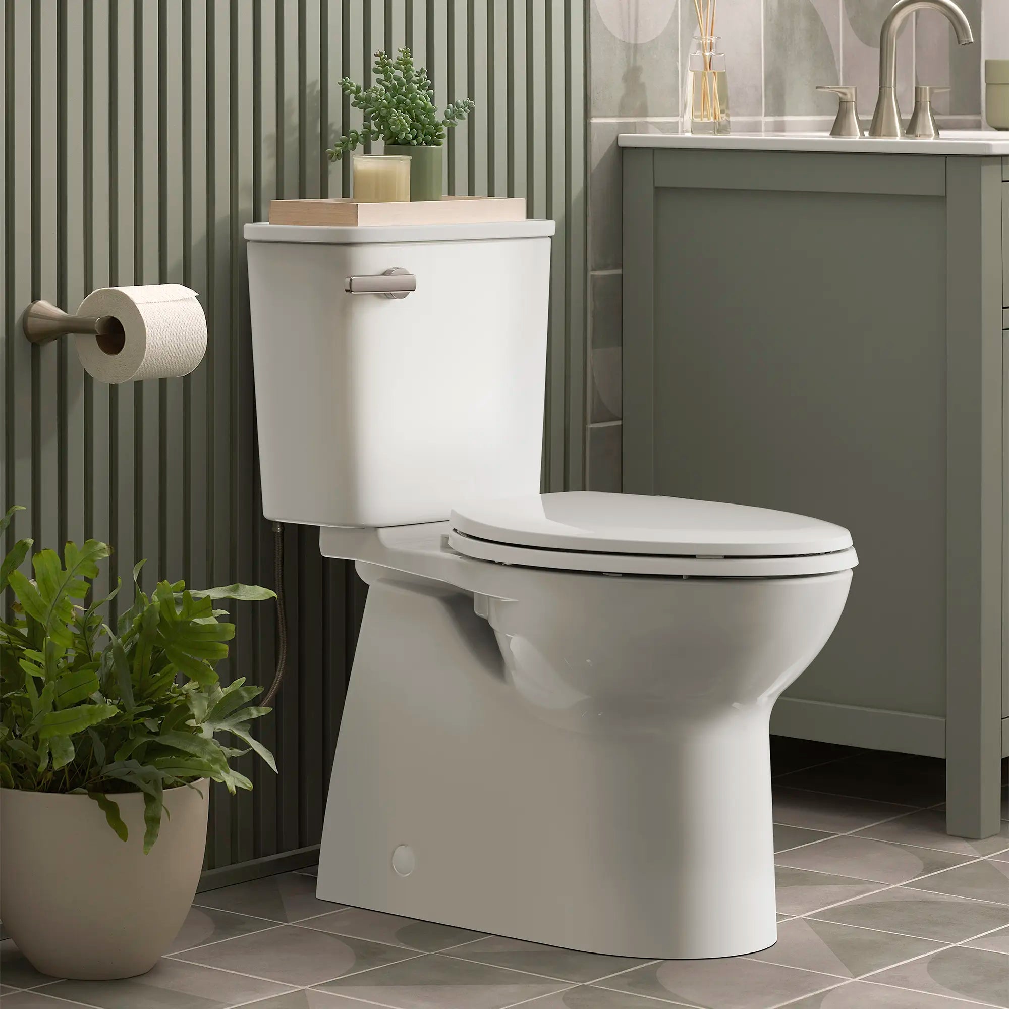 Aspirations Two-Piece Concealed 1.28 gpf/4.8 Lpf Chair Height Elongated Toilet With Seat // WHITE // 237594_Aspirations_EnvironmentCloseUp_785AA801.020_0001_Jan2024_1_CDNwebp.webp