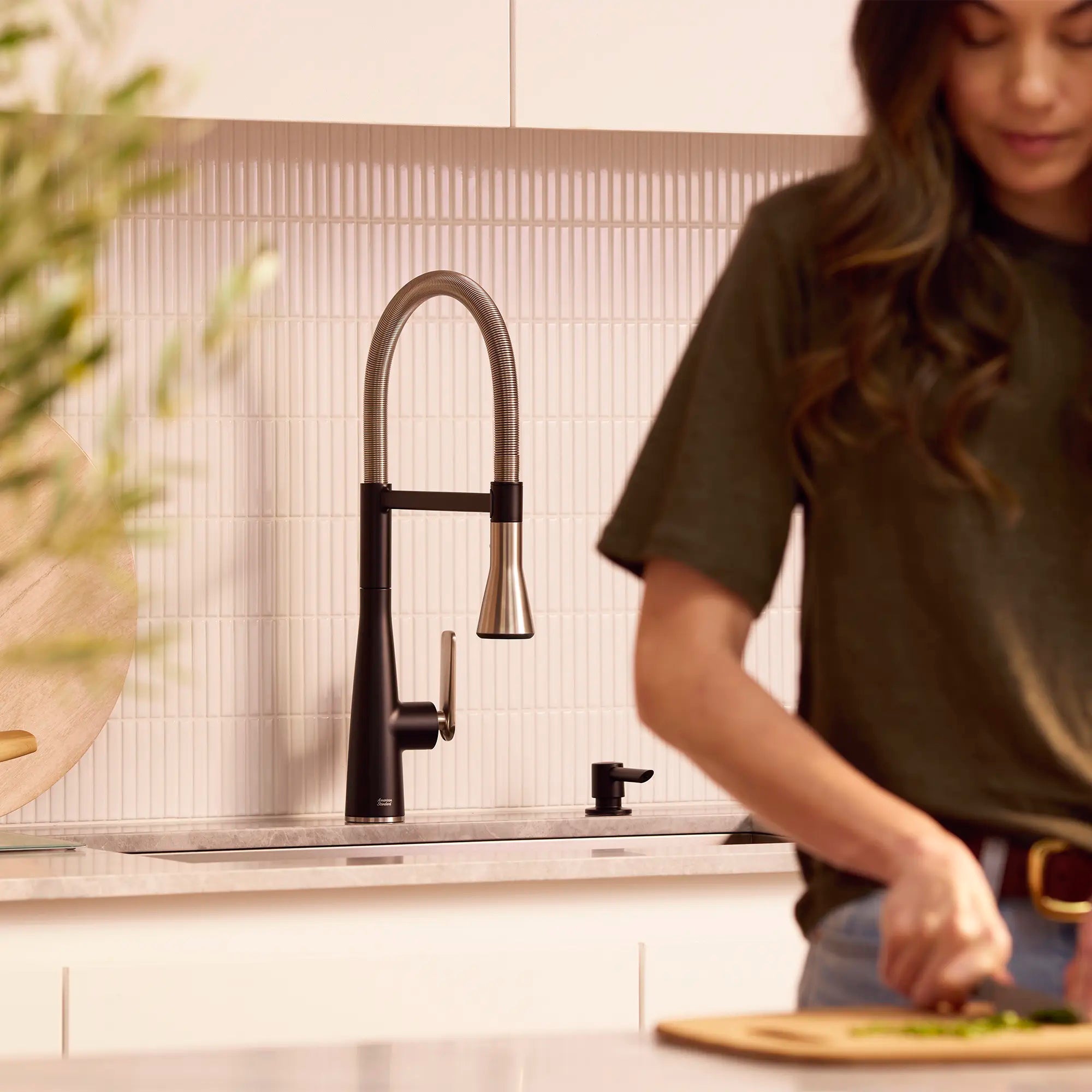 Aspirations Semi-Pro Kitchen Faucet  // MATTE BLACK/STAINLESS STEEL // 262125_Aspirations_Lifestyle_1048824230_0002_April2025_CDNwebp.webp