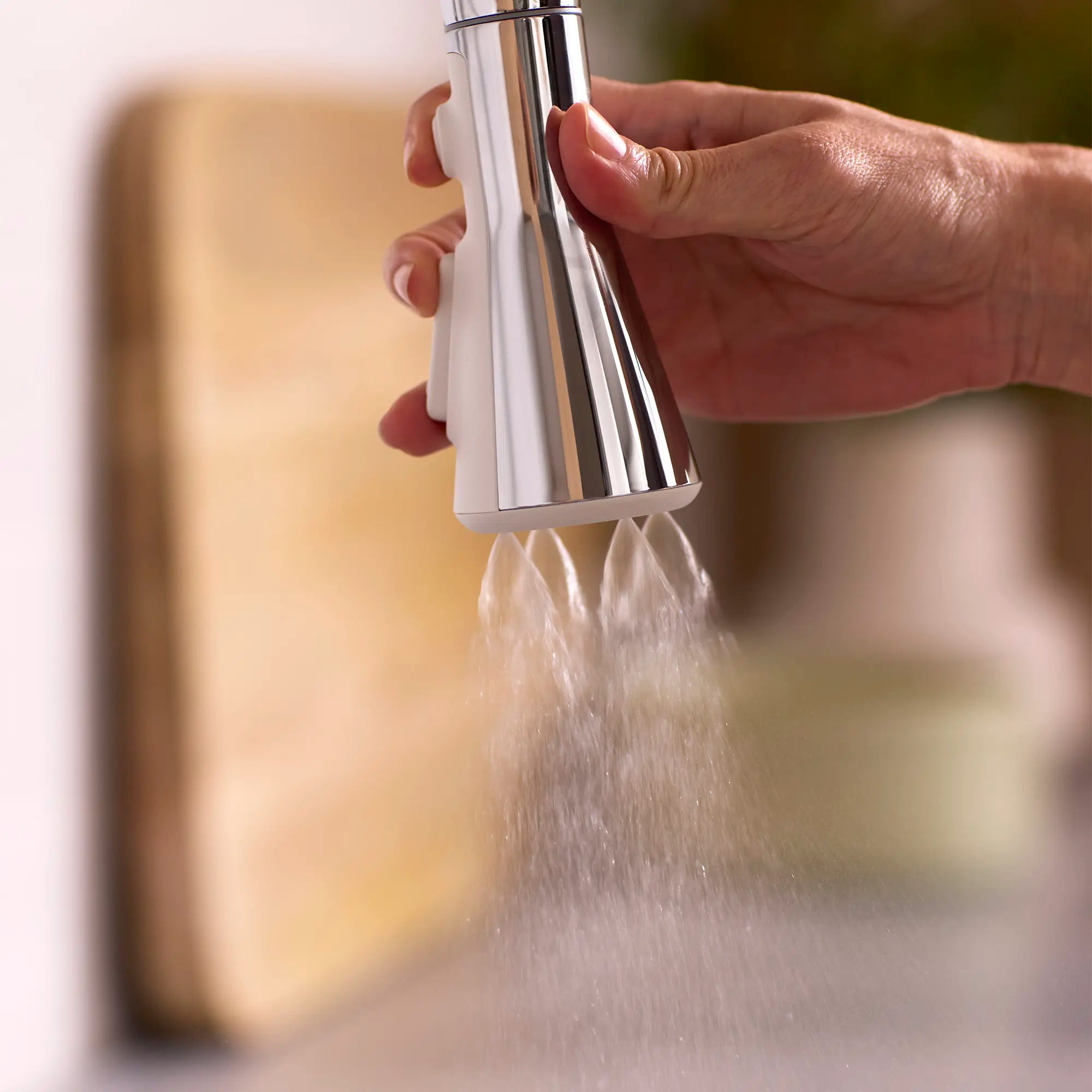 Aspirations Pull-Down Kitchen Faucet  // POLISHED CHROME // 262129_Aspirations_Lifestyle_Spray_1048810000_0001_April2025_CDNwebp.webp